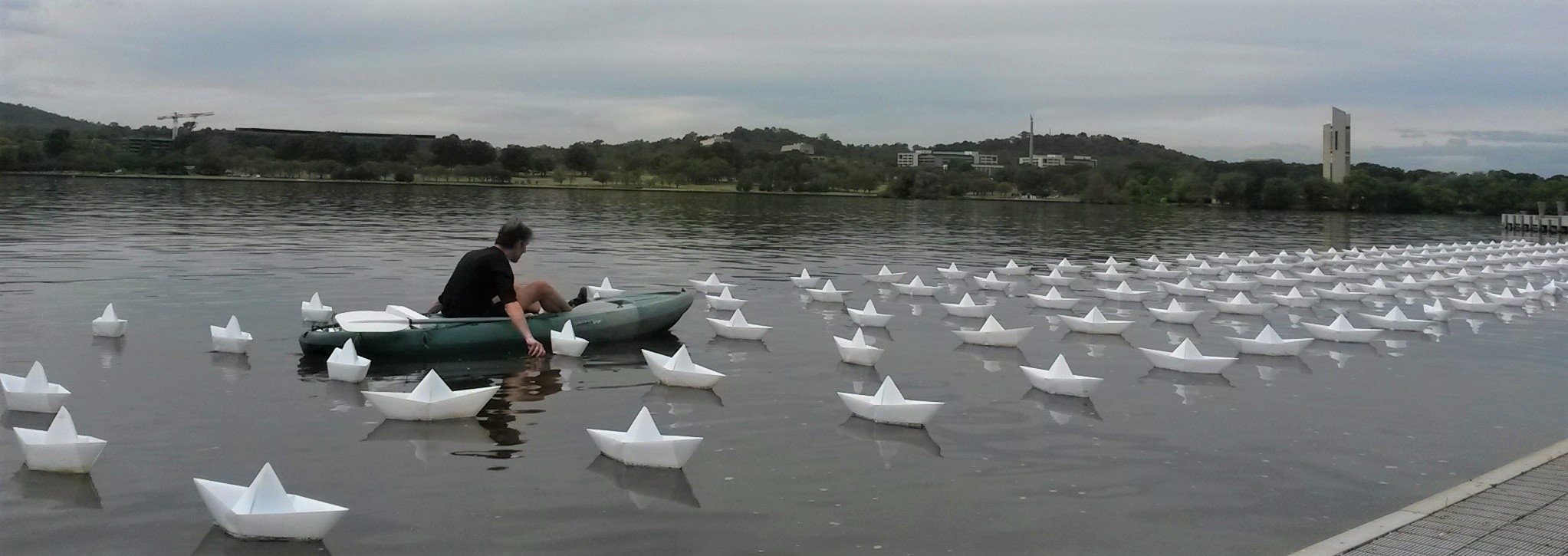 VOYAGE by Aether & Hemera, a  flotilla, origami boats, lit, paper boats, floating  artwork, from London to Australia