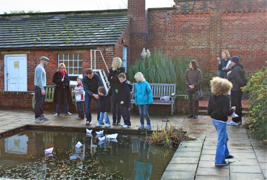 flotilla, origami boats, lit, paper boats, floating art, from London